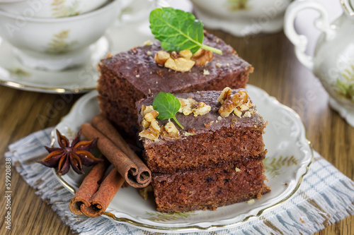 Slice of chocolate cake with nuts