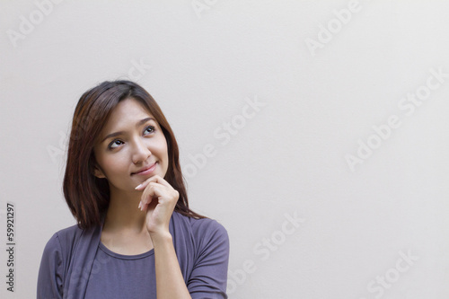 happy woman looking at blank background with text or copy space