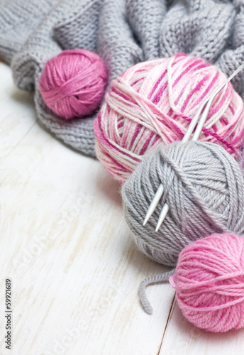 balls of pink and gray yarn