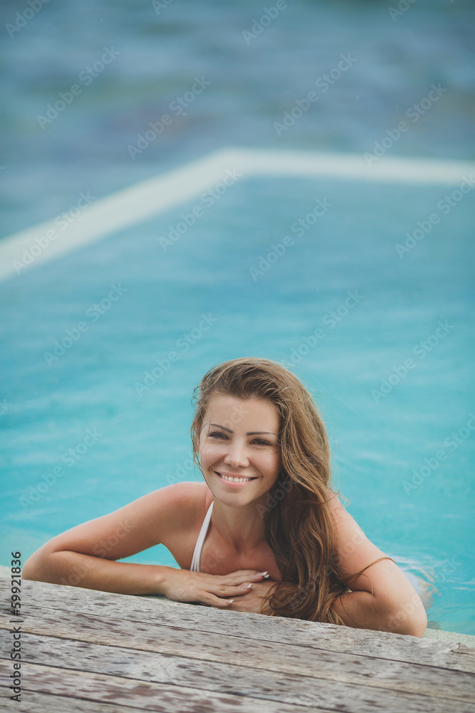 Young female enjoying sunny day on tropical beach Young female enjoying sunny day on tropical beach