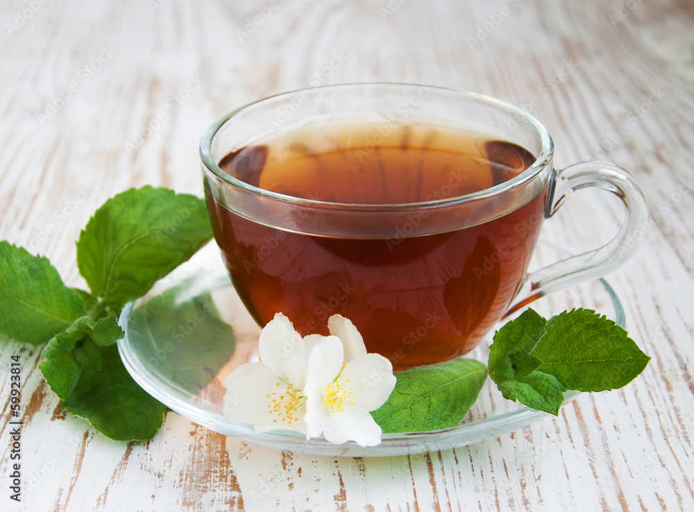 Tea and jasmine flowers and mint
