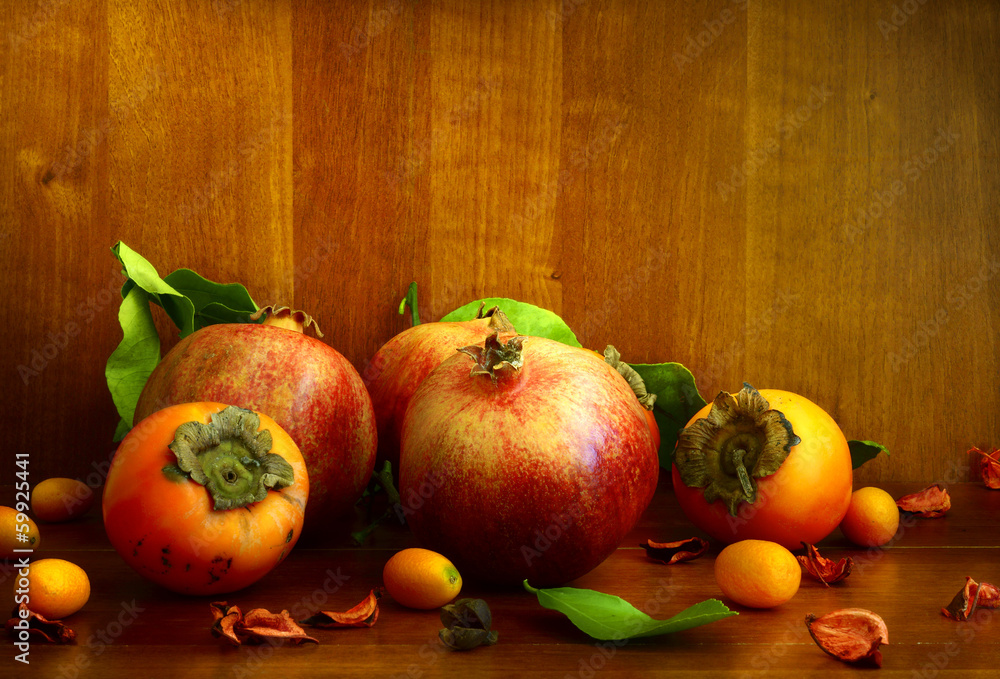 Persimmon, pomegranate and citrus fruits Persimmon, pomegranate and citrus fruits