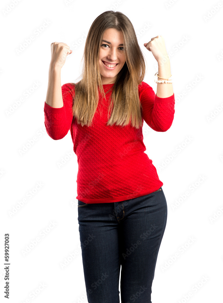 Young woman winner over isolated white background Young woman winner over isolated white background