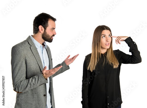 Businesswoman making a crazy gesture over white background