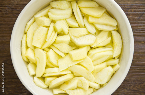 Sliced apples in water for an apple pie
