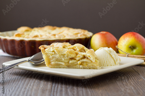 Slice of apple pie and ice cream, wide and horizontal