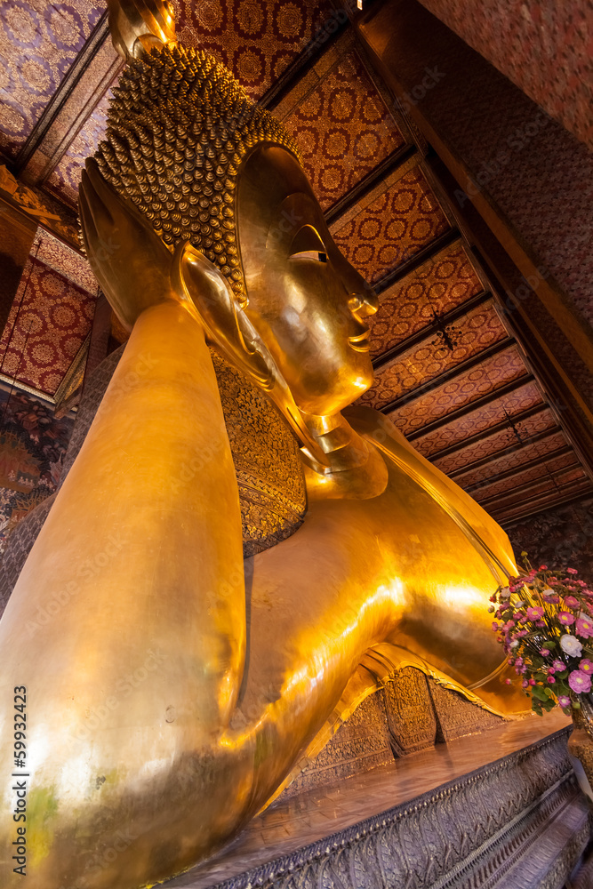 Golden big Buddha face in Wat Pho , Bangkok , Thailand. Grand Pa