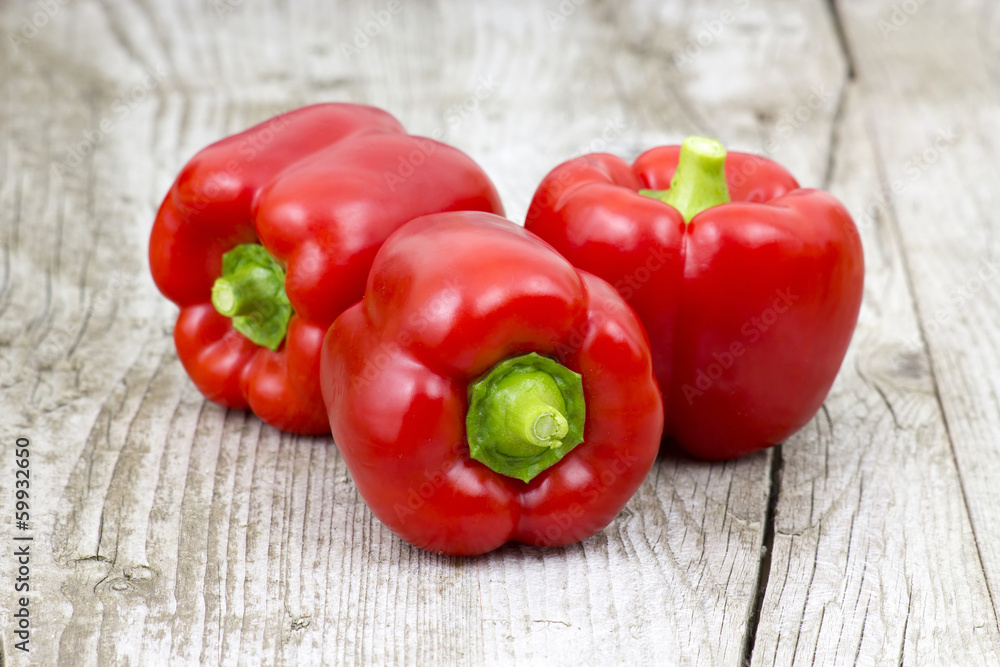 red peppers on wooden background red peppers on wooden background