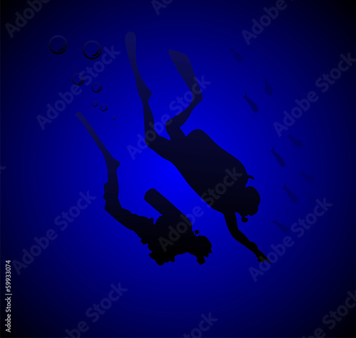 Divers in a deep immersion