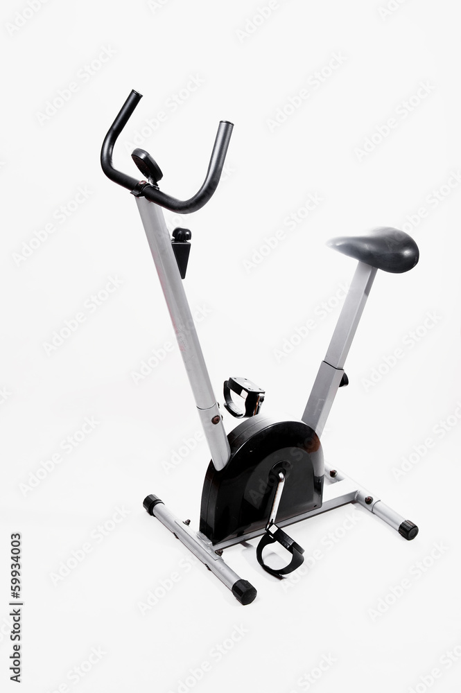 Woman doing sports on exercise bike Woman doing sports on exercise bike