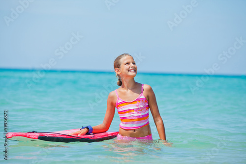 Girl has fun with the surfboard