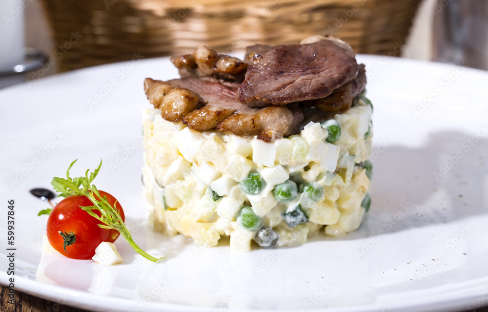 salad with meat on a table in a restaurant