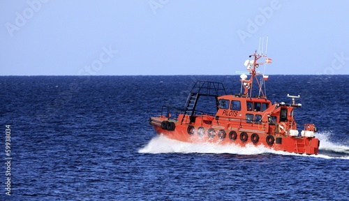 pilot boat orange tugboat at the sea