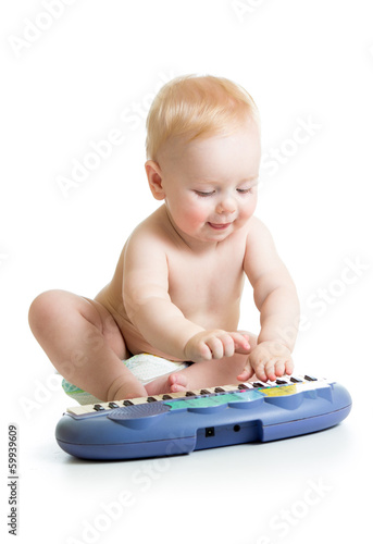 adorable child playing elec...