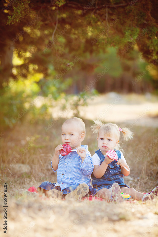 cute boy and girl playing together summer outdoors cute boy and girl playing together summer outdoors