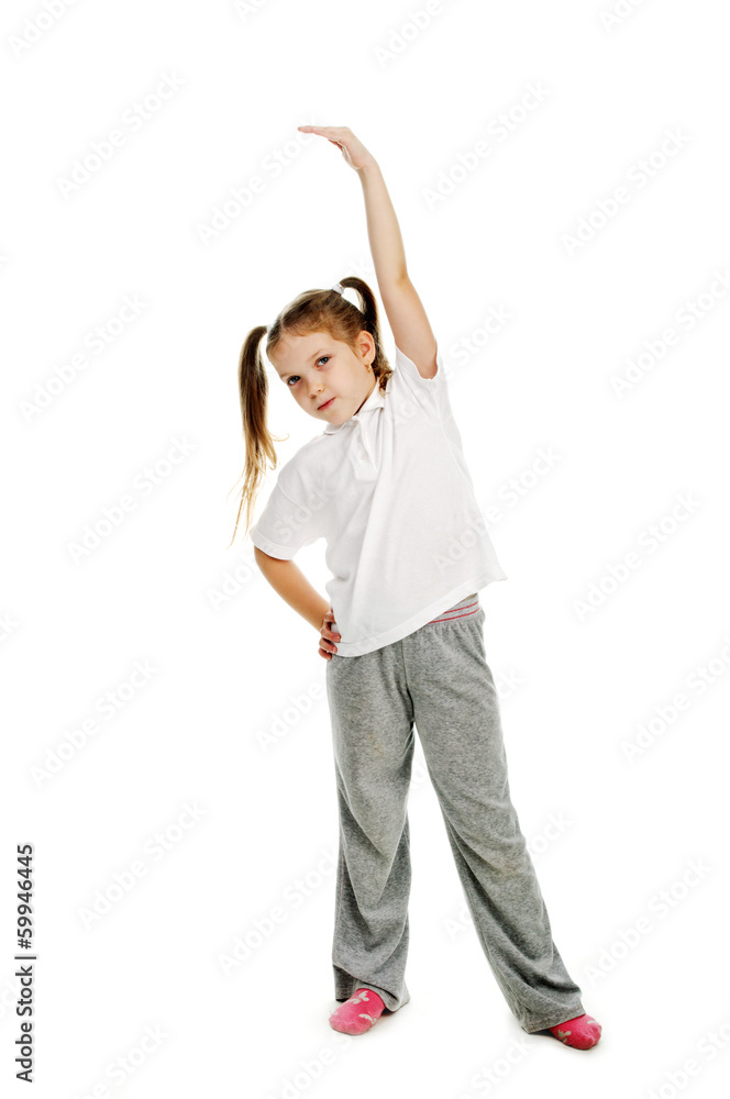 Little girl doing gymnastics in studio. Little girl doing gymnastics in studio.