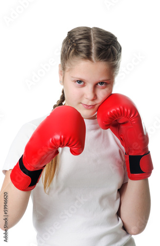 Beautiful young little girl wearing a pair of boxing gloves © Mykola Velychko
