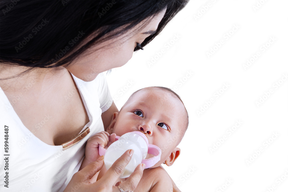 Young mother feeding her baby isolated