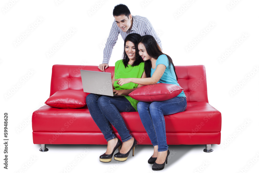 Young people using a laptop Young people using a laptop