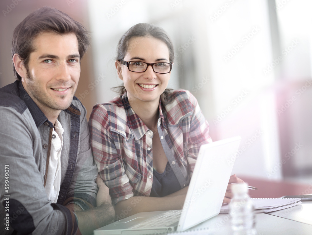Fototapeta premium Young people working on laptop computer