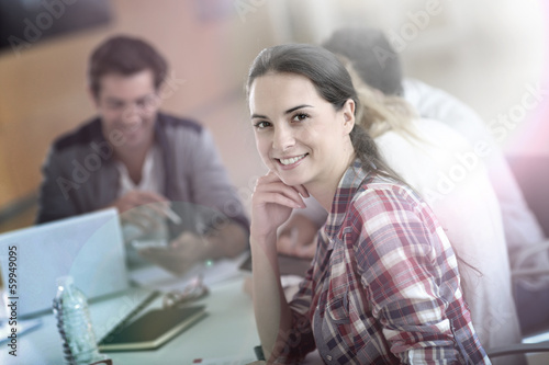 Cheerful young woman at university