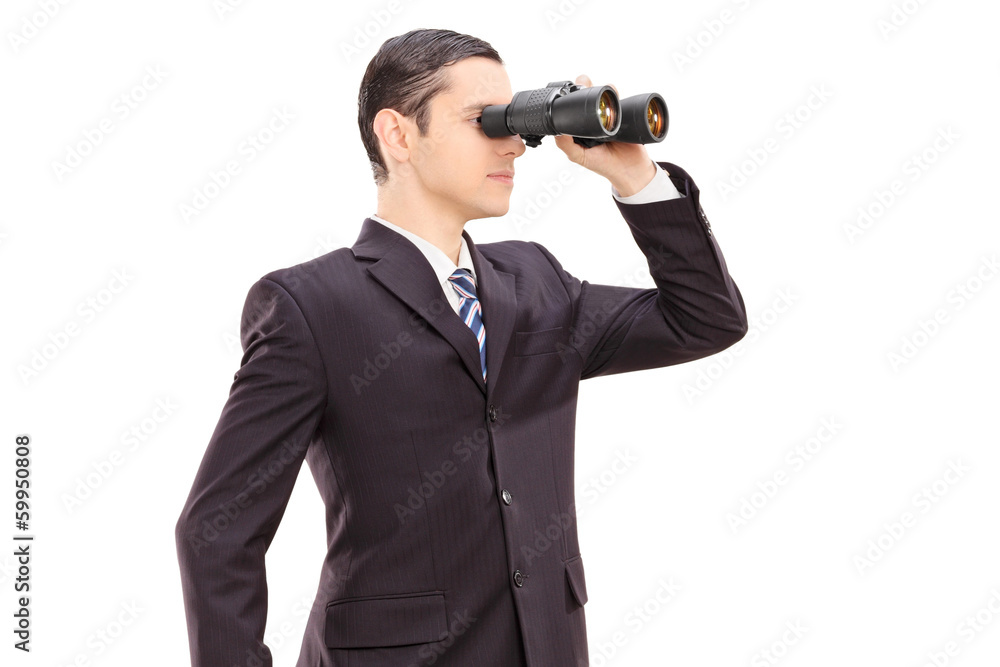 Young businessman looking through binocular Young businessman looking through binocular