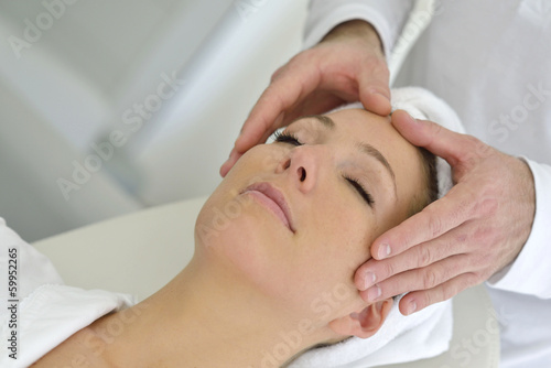 Woman relaxing in spa institute