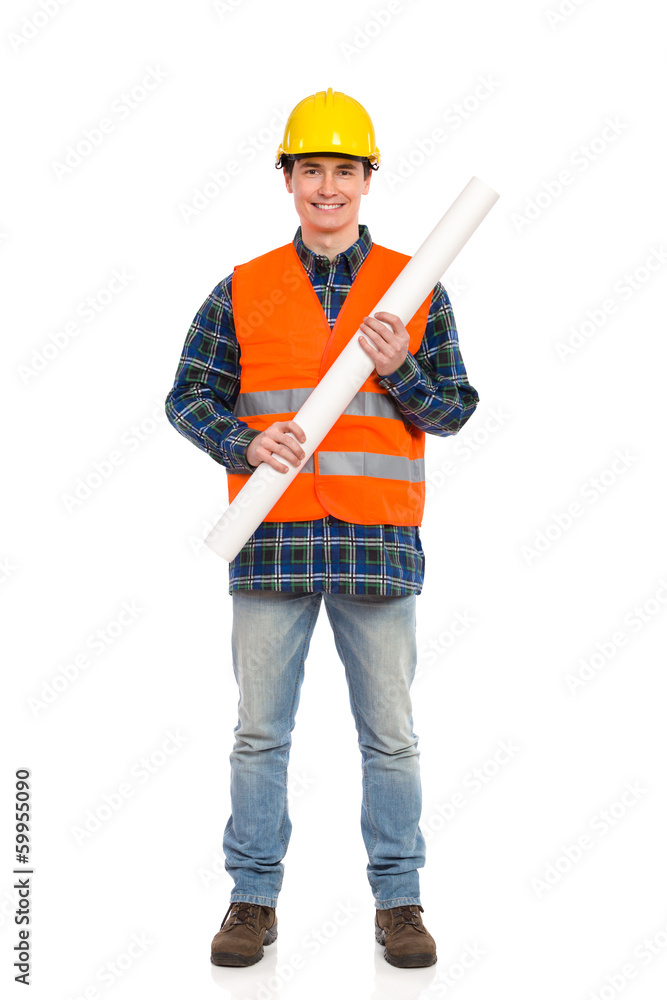 Smiling construction worker holding rolled paper plan. Smiling construction worker holding rolled paper plan.