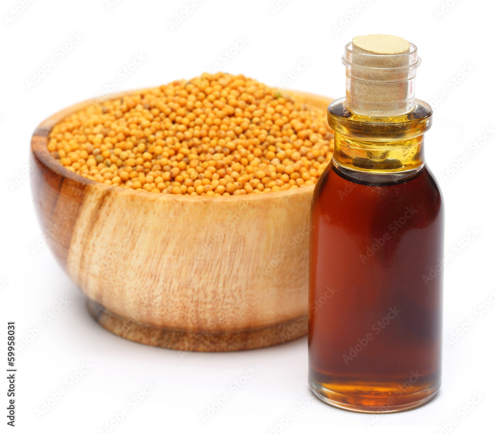 Fresh golden mustard on a wooden pot with oil Fresh golden mustard on a wooden pot with oil