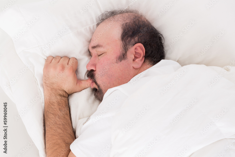 Man sucking his thumb while sleeping Man sucking his thumb while sleeping