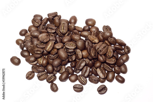Roasted brown coffee beans isolated on white background
