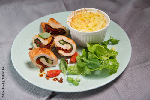Chicken fillet stuffed with basil, mozzarella and dried tomatoes