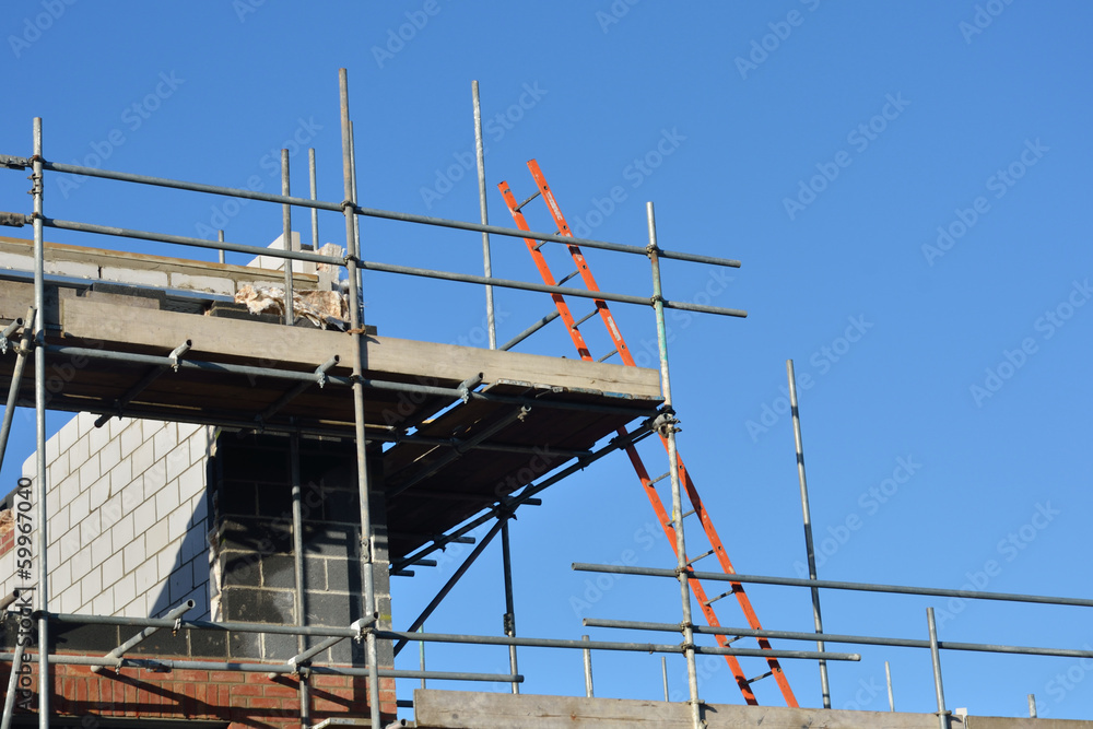 Construction site with ladder and scaffolding