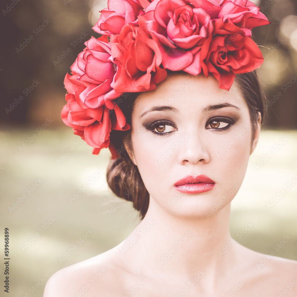 Young beautiful japanese woman with pink and red flowers Young beautiful japanese woman with pink and red flowers