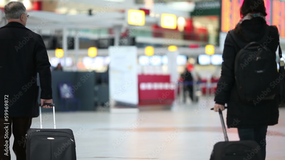 people with their suitcases in a modern airport hall people with their suitcases in a modern airport hall