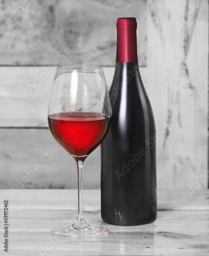 Red wine bottle, one glass