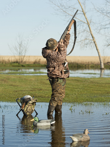 Hunter taking aim photo