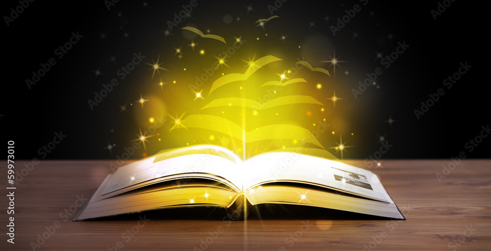 Open book with golden glow flying paper pages Open book with golden glow flying paper pages