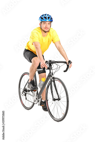 Young male biker looking at camera