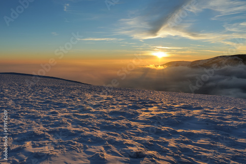 Beautiful sunset in winter mountain