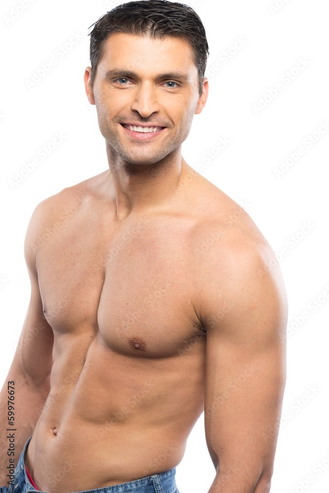 Handsome young man in blue jeans with naked torso Handsome young man in blue jeans with naked torso