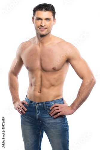 Handsome young man in blue jeans with naked torso