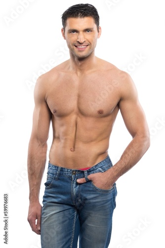 Handsome young man in blue jeans with naked torso