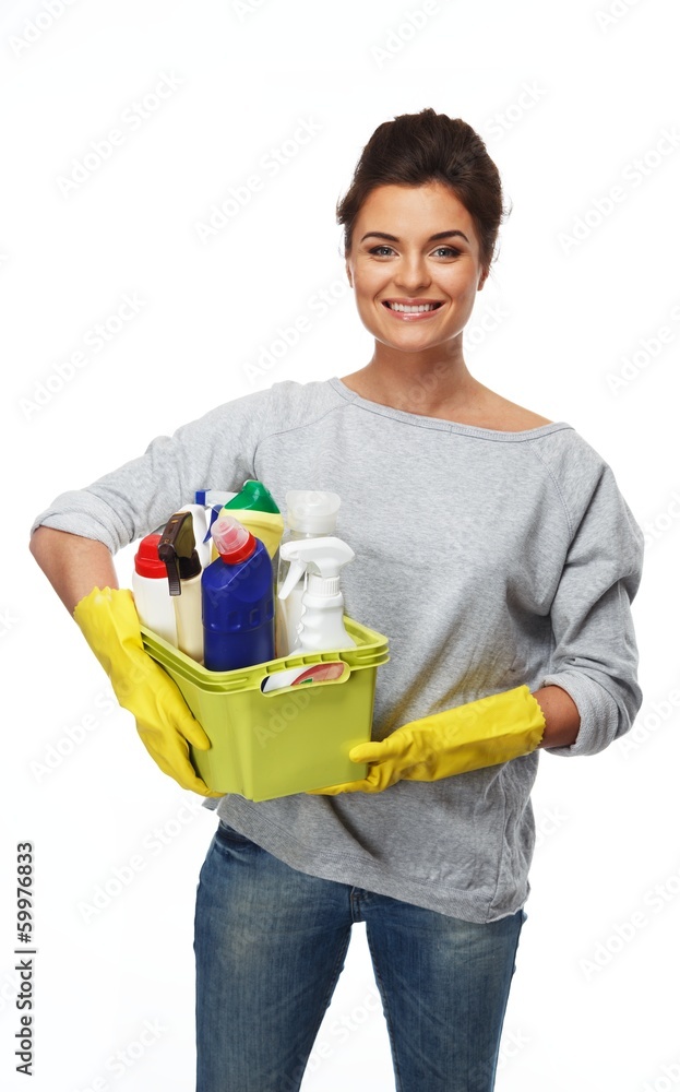Beautiful brunette woman holding different cleaning stuff Beautiful brunette woman holding different cleaning stuff