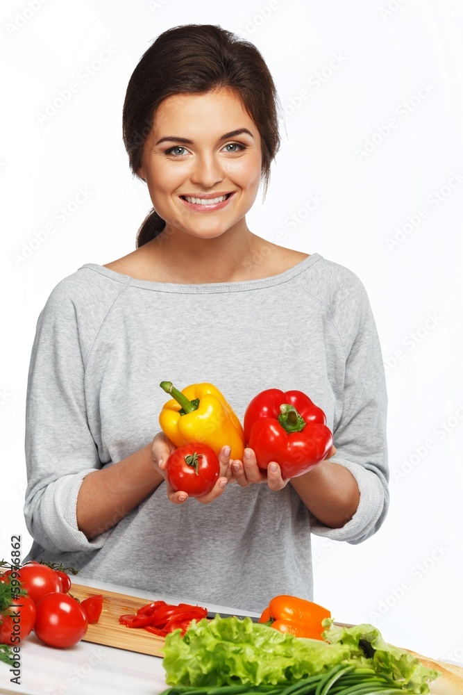 Beautiful young woman holding fresh vegetables Beautiful young woman holding fresh vegetables