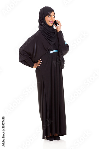 modern muslim woman talking on cell phone