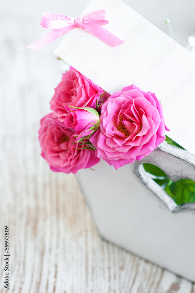 Card with roses on the table