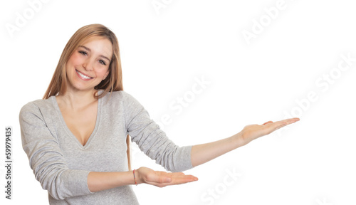 Attractive woman presents something