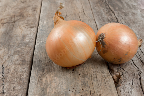 Onions on an old wooden background