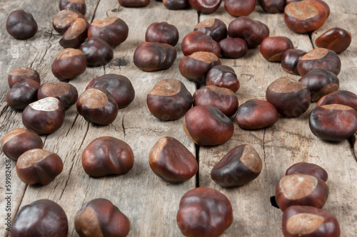 Closeup chestnuts on wooden desk